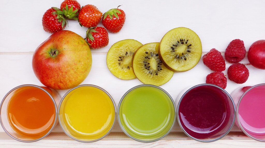 glasses of juice in colours ranging from yellow to red