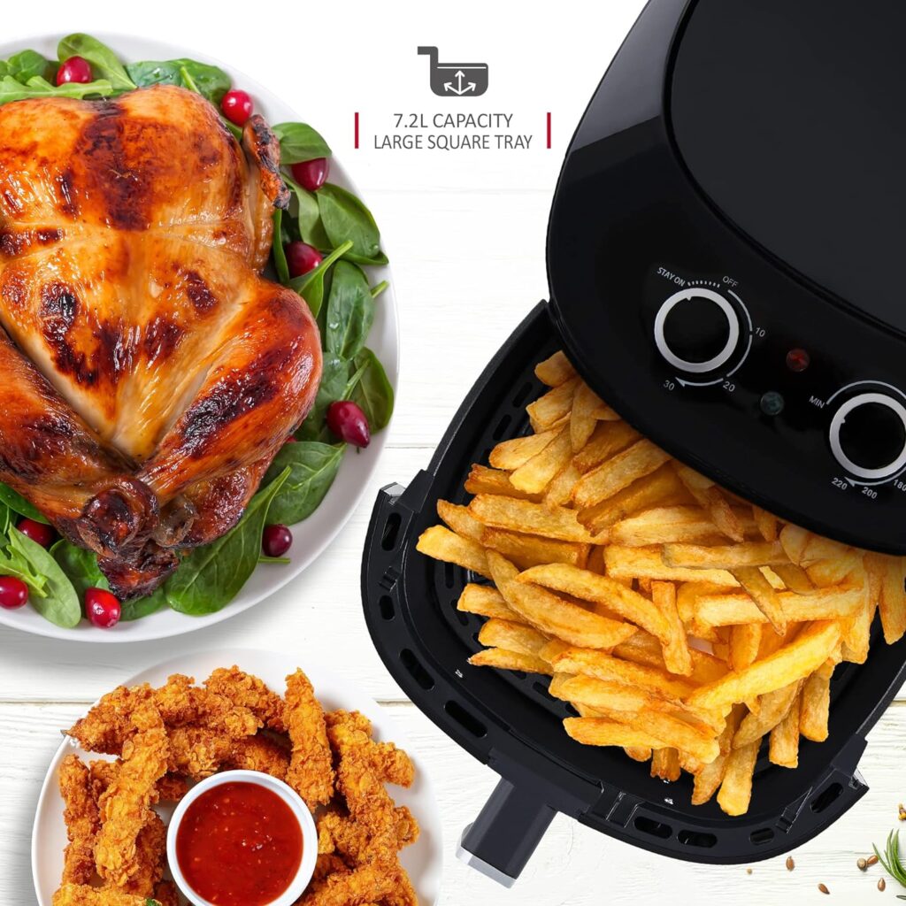 Netta 7.2L air fryer alongside a roast chicken and some chicken pieces arranged around a small bowl of ketchup